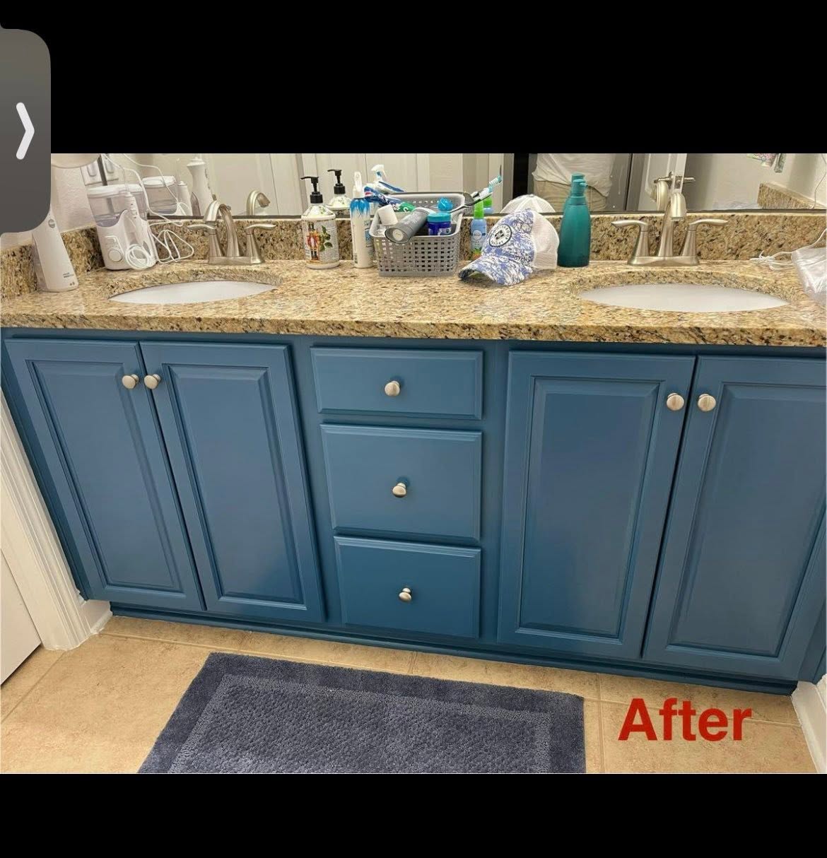 Double bathroom vanity repainted in a deep blue with granite countertop